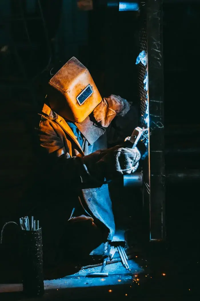 Welder in a helmet at work